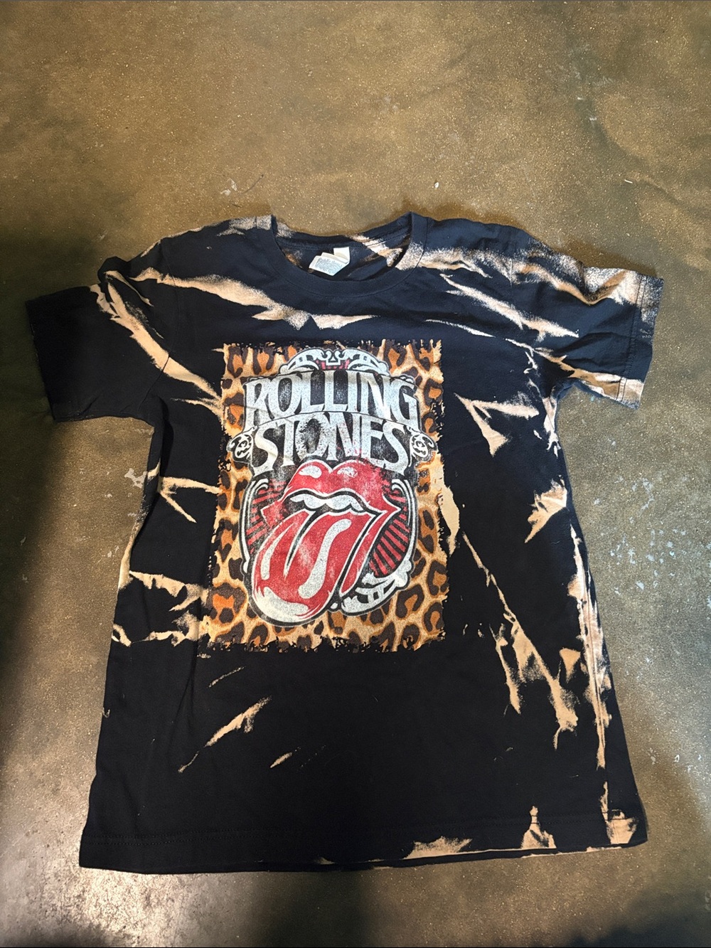 the Rolling Stones Black Bleach-Effect Tee with Red Tongue Graphic